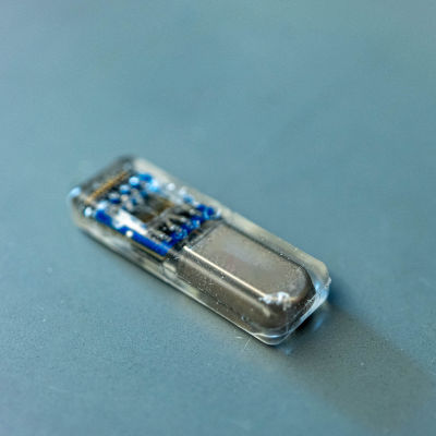 Implantable device produces multiple drugs from living cells